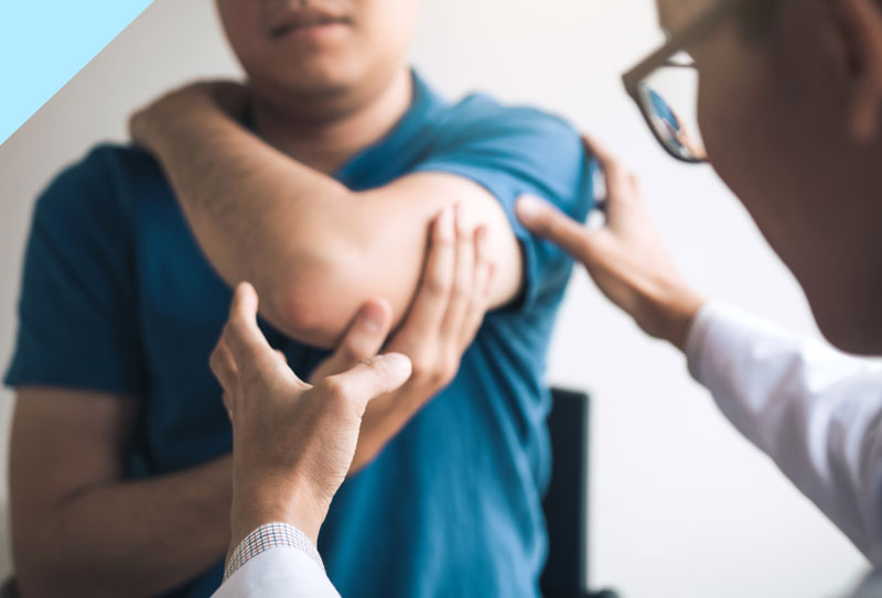 A Patient describing a shoulder injury to a doctor.