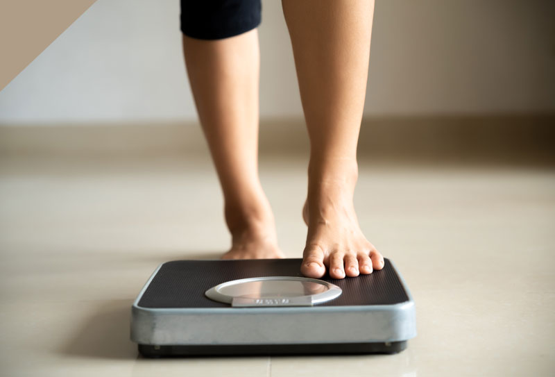 A Person standing on a weighing scales
