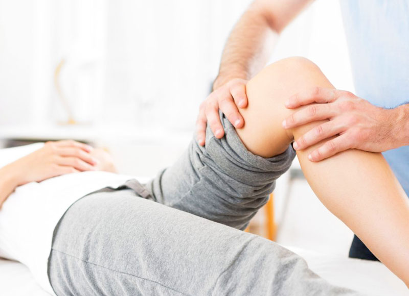 A patient receiving treatment on their knee